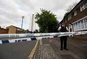 Police officers guard a cordon