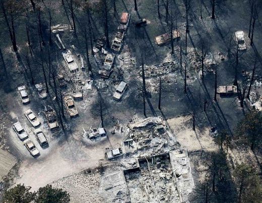 destroyed home and vehicles