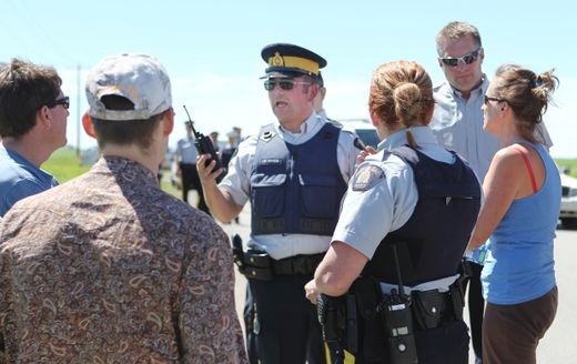 Click to enlarge Evacuees confronted the RCMP