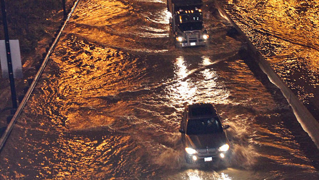 Cars were up to their doors in water after flooding covered Toronto's Don Valley Parkway in May. 