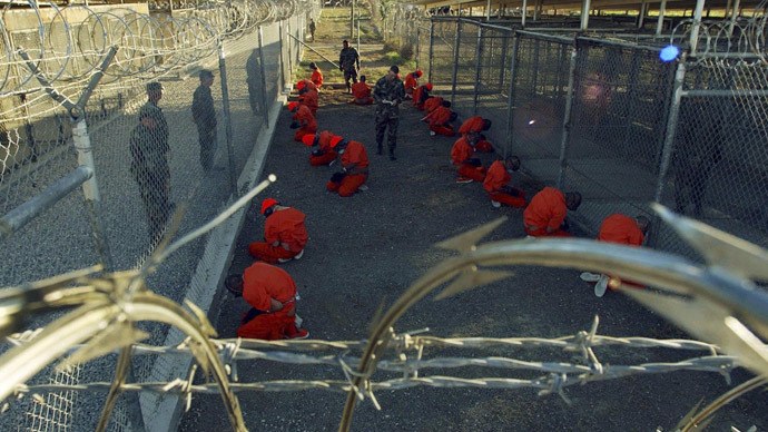 Detainees in orange jumpsuits