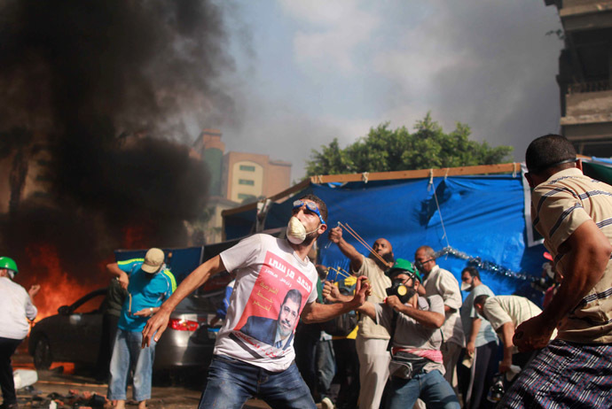 Click to enlarge Supporters of the Muslim Brotherhood and Egypt's ousted president Mohamed Morsi