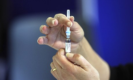 A nurse prepares an MMR jab