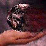 Earth in hand, blowing away