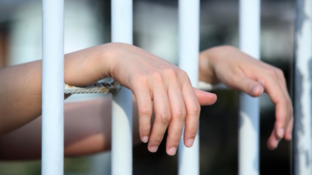 hands in jail