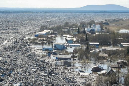Click to enlarge A River ice strewn about the flood