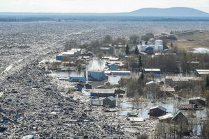Click to enlarge A River ice strewn about the flood