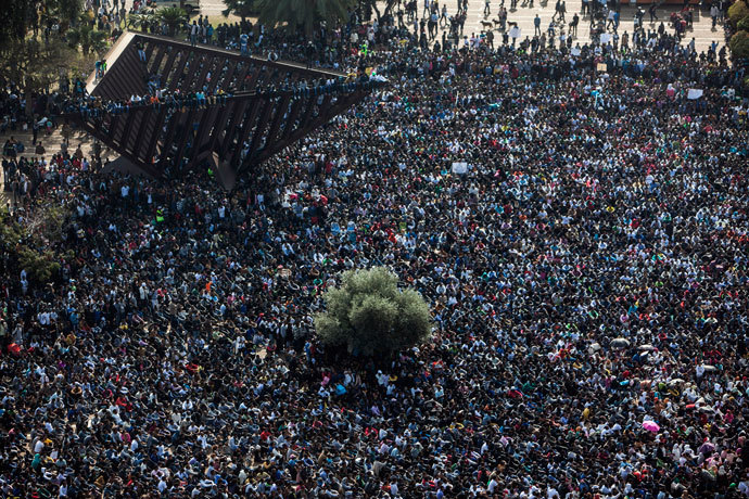 African migrants attend a protest
