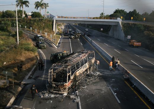 bus was set alight, allegedly by gang members