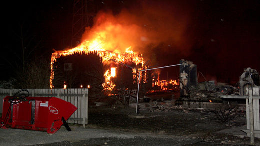  A fire blasts over a house, destroying many of the famed 18th- and 19th-century wooden houses
