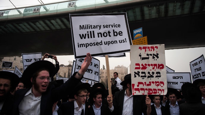  Ultra-Orthodox Jews holding a placard