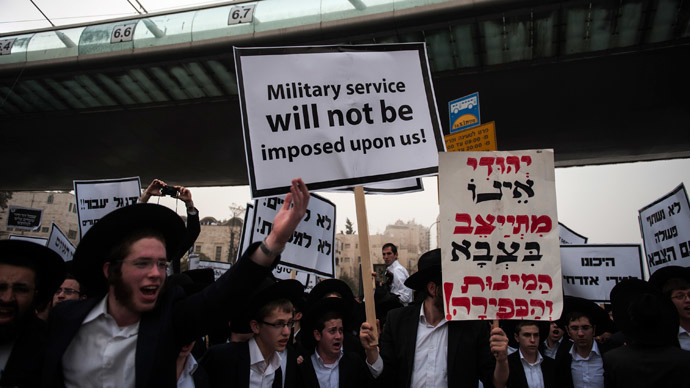 Click to enlarge Ultra-Orthodox Jews holding a placard