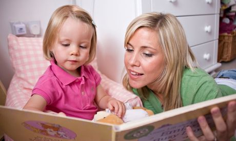 Click to enlarge mother reading to child