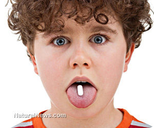 Click to enlarge child with pill