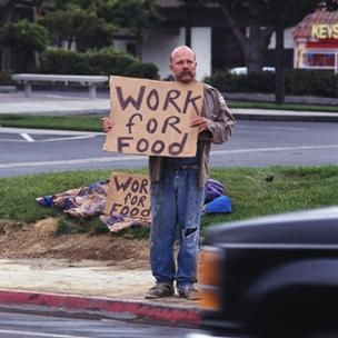 Click to enlarge man with sign 'work for food'