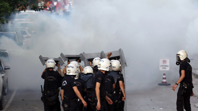 Turkish riot police use tear gas against protesters in Ankara on May 14, 2014.