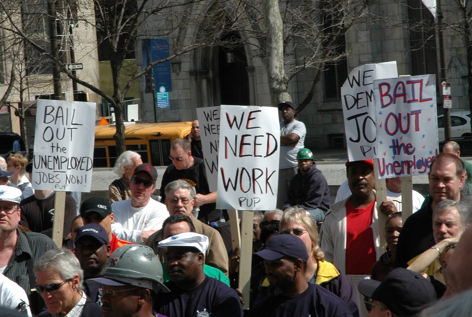 unemployed folk with signage