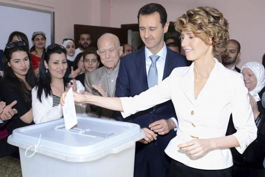 Click to enlarge Syria's President Bashar al-Assad and his wife Asma