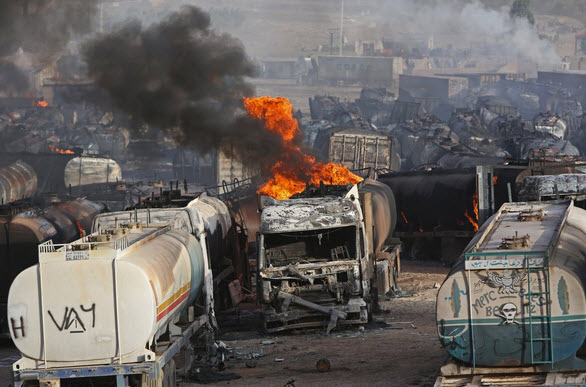 Click to enlarge Trucks on fire in Aghanistan