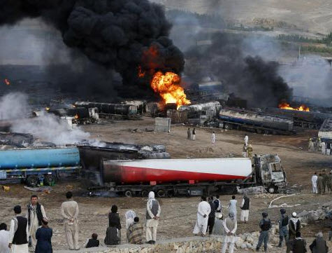 Click to enlarge Trucks on fire in Aghanistan