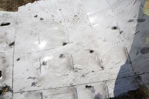 Click to enlarge MH17 bullet holes skin