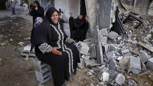Click to enlarge Palestinian woman in rubble