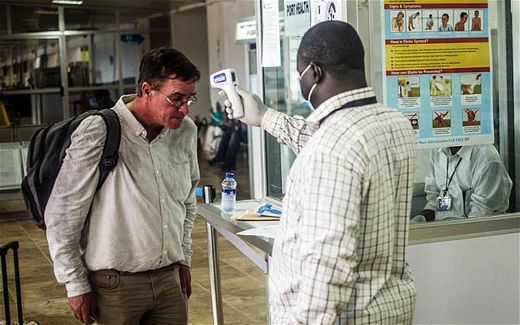 man taking fever test